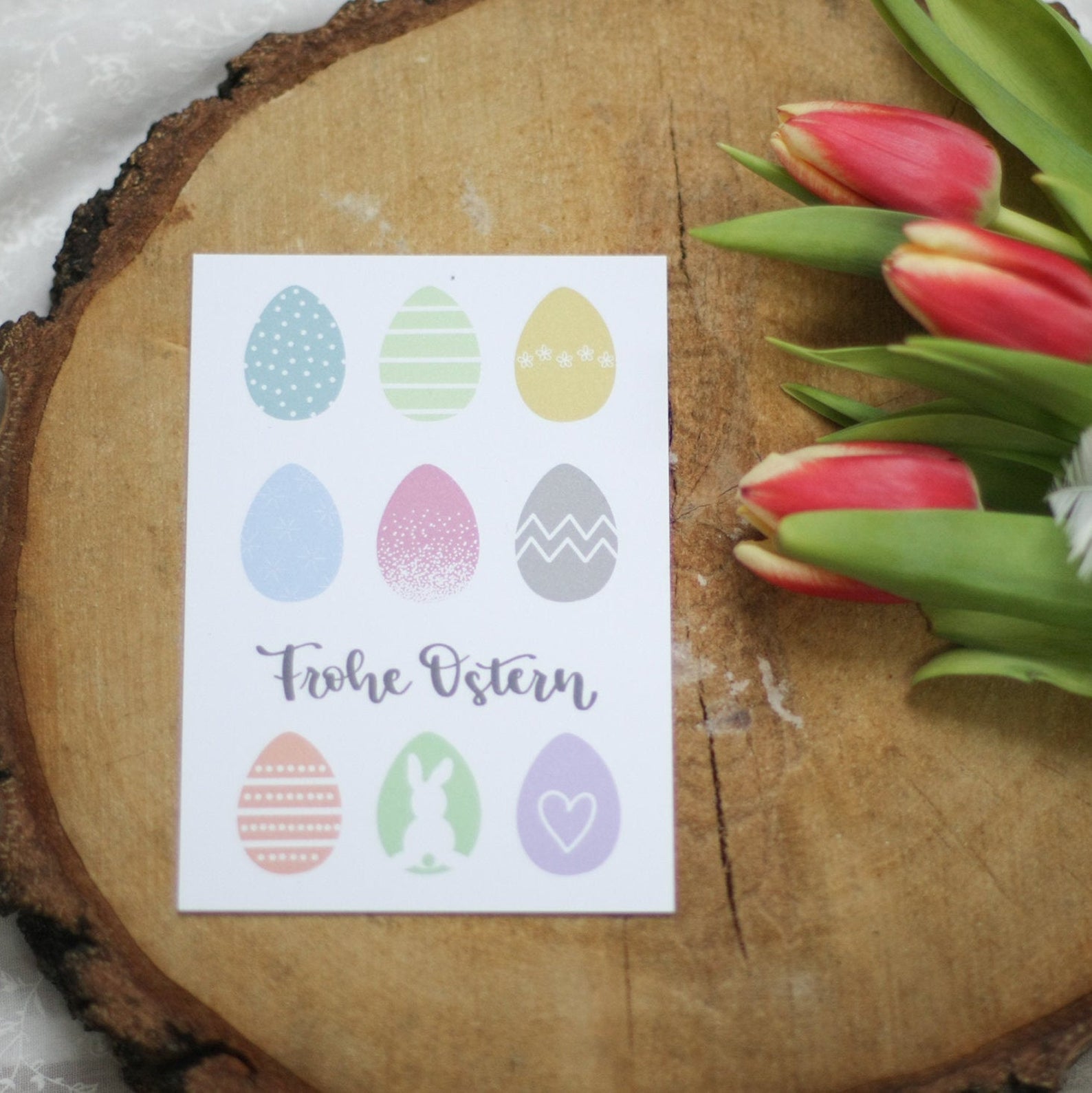 Postkarte „Frohe Ostern“, mit bunten Ostereiern